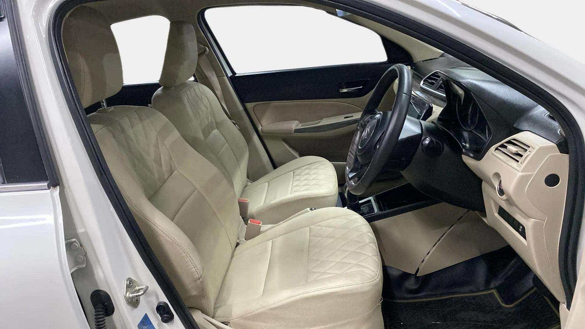 Front interior seats and dashboard of a Maruti Suzuki Dzire 2018-2023
