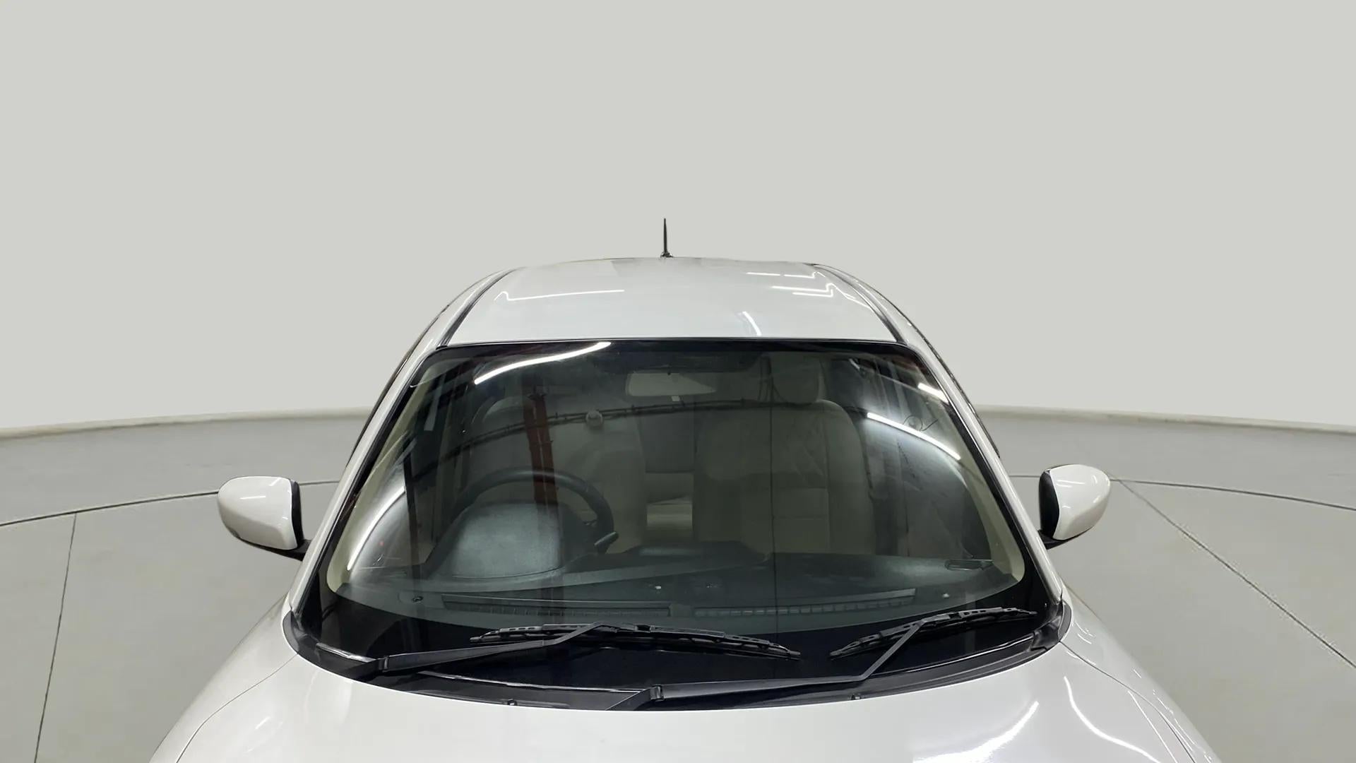 Top front view of a arctic white Maruti Suzuki Dzire 2018-2023