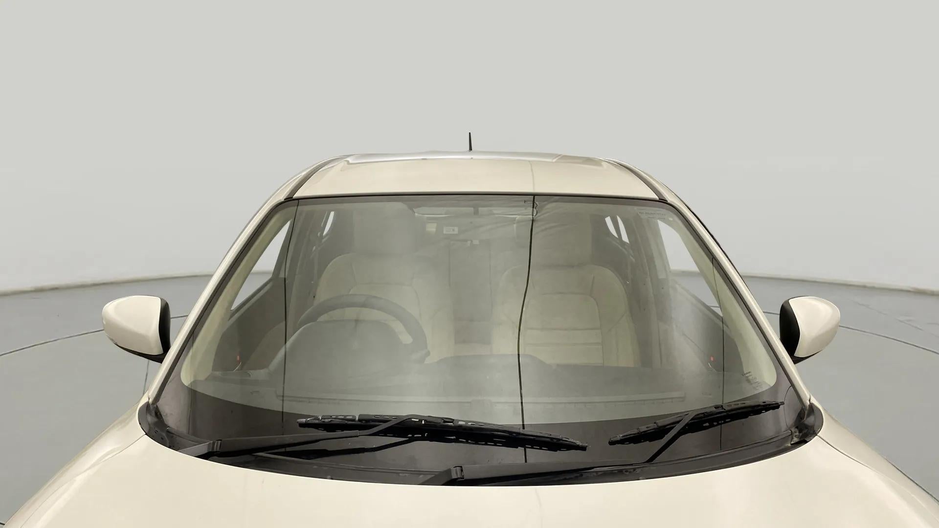 Front windshield and dashboard view of a Maruti Suzuki Dzire