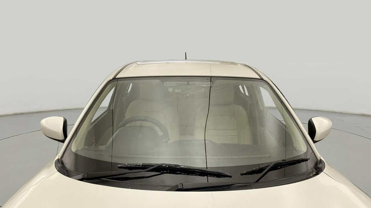 Front windshield and dashboard view of a Maruti Suzuki Dzire