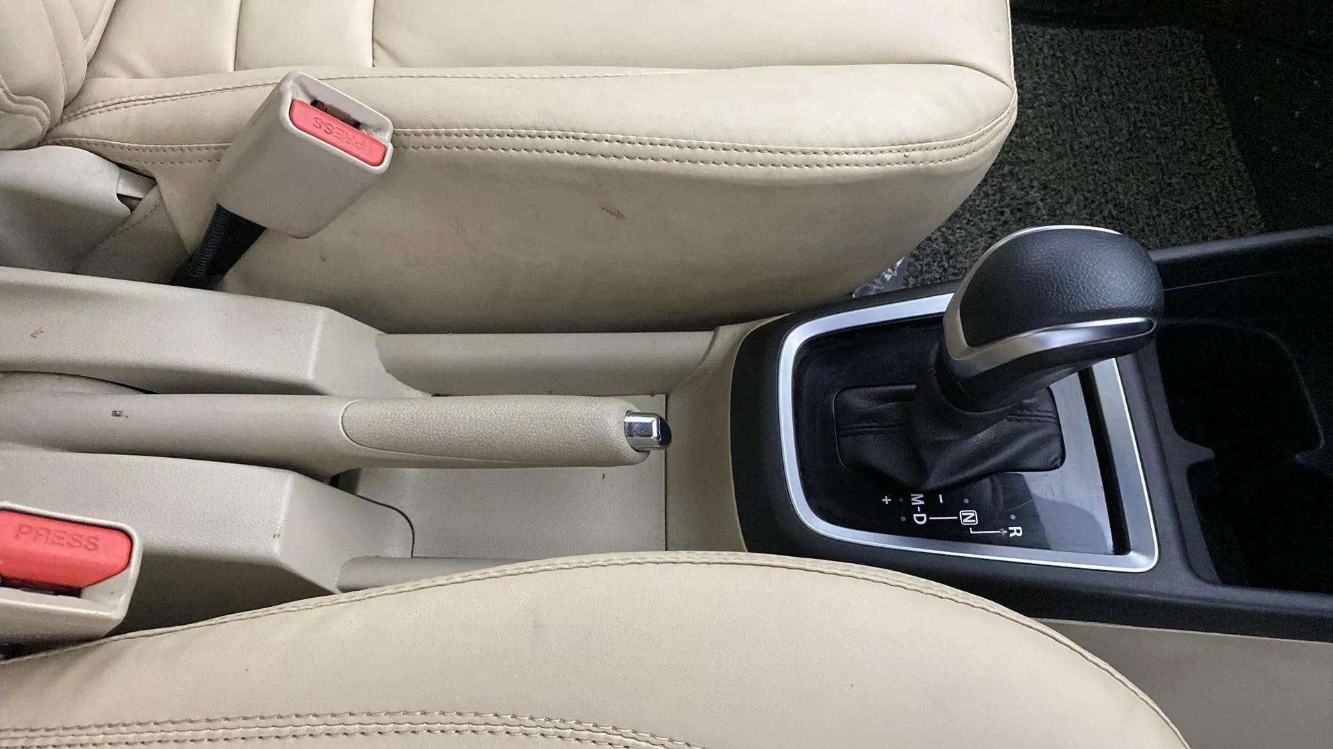 Interior center console with gear lever of a Maruti Suzuki Dzire