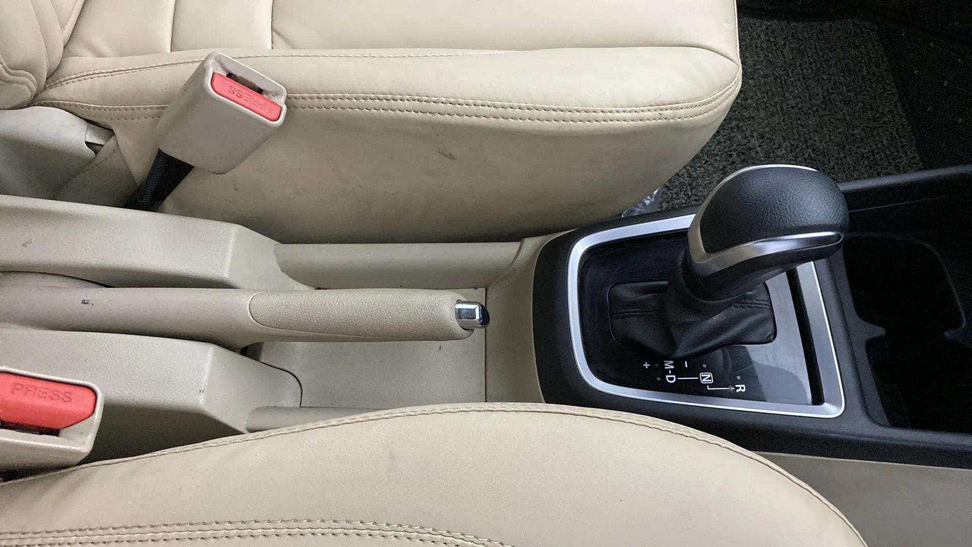 Interior center console with gear lever of a Maruti Suzuki Dzire