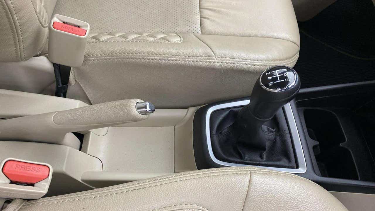 Gear shift and handbrake area of a Maruti Suzuki Dzire 2018-2023