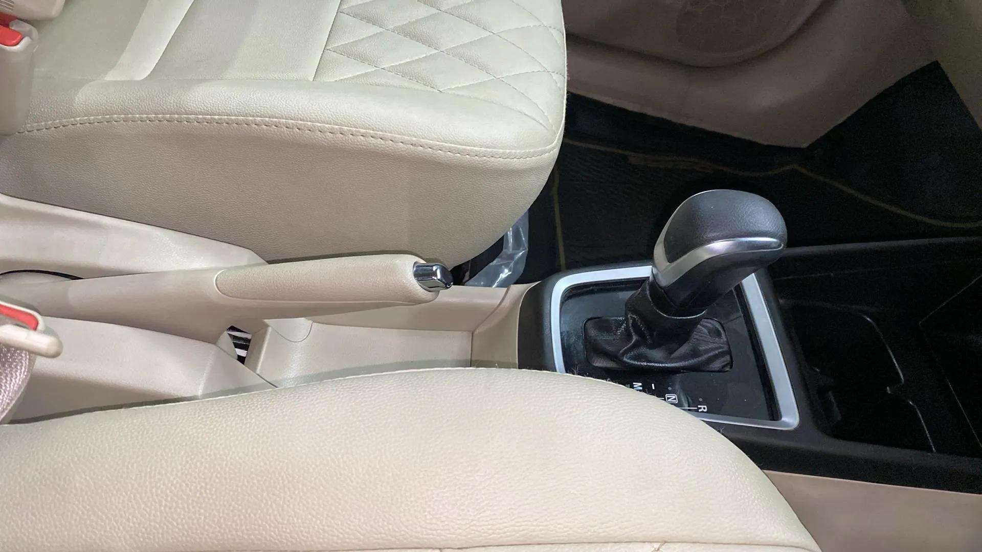 Interior center console and gear shifter of a Maruti Suzuki Dzire 2018-2023