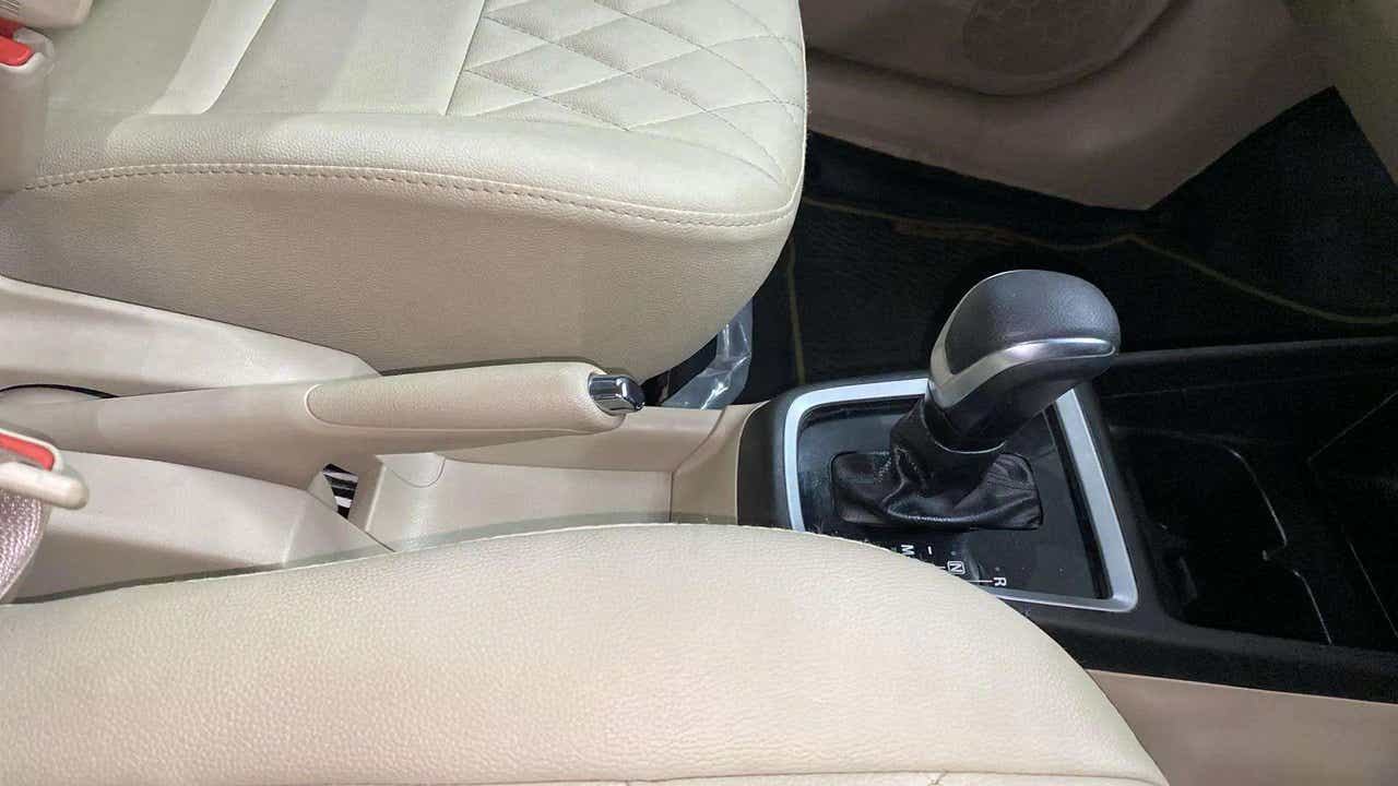 Interior center console and gear shifter of a Maruti Suzuki Dzire 2018-2023