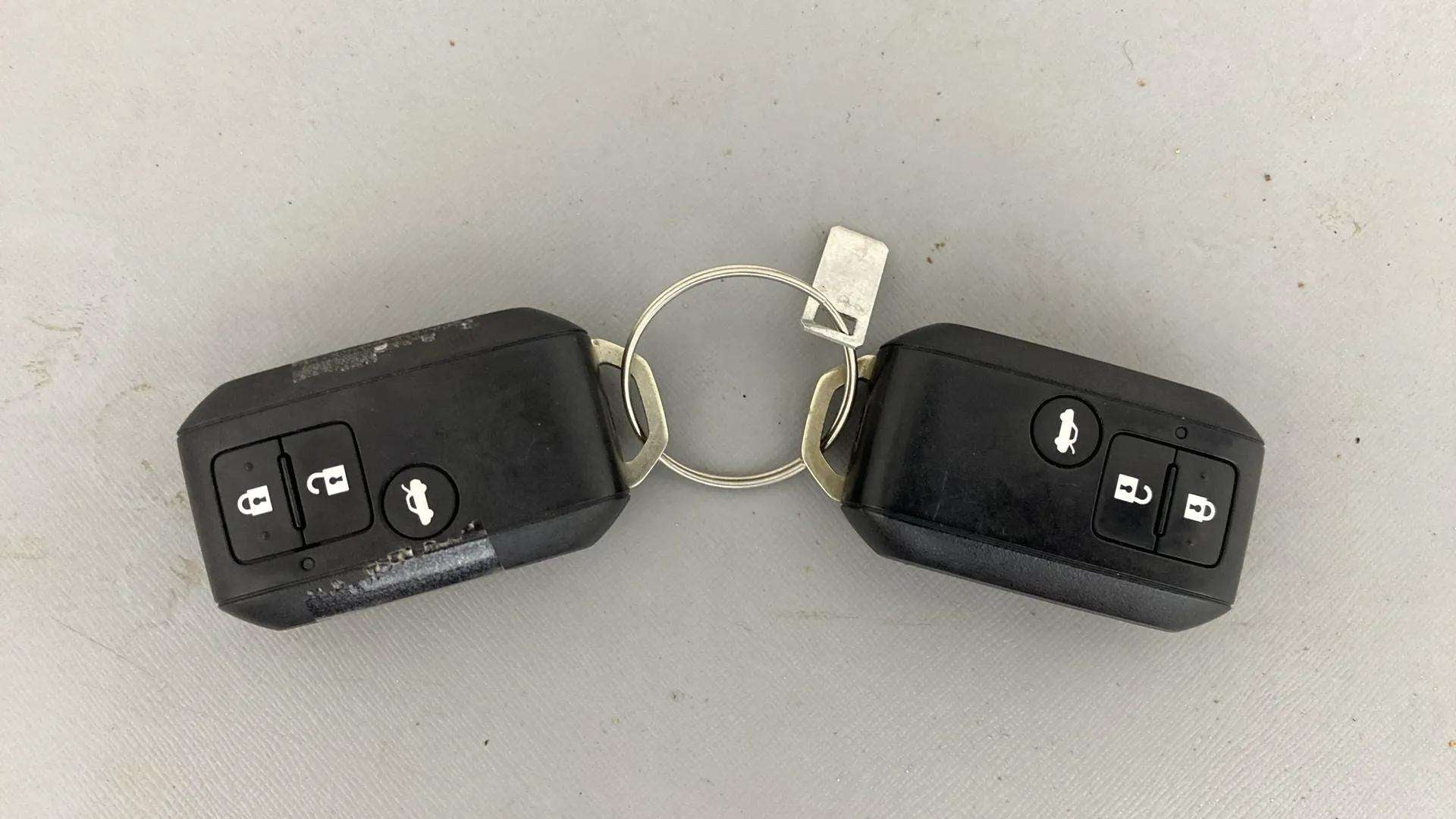 Top view of a Maruti Suzuki Dzire car key fob pair