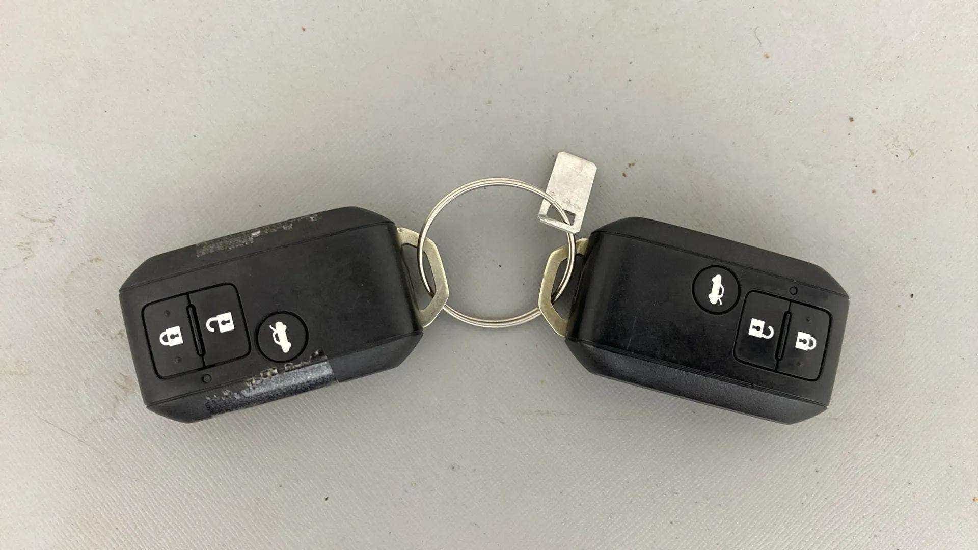 Top view of a Maruti Suzuki Dzire car key fob pair