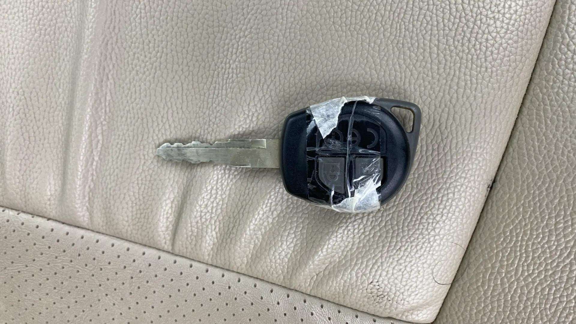 Car key on leather seat of a Maruti Suzuki Dzire 2018-2023