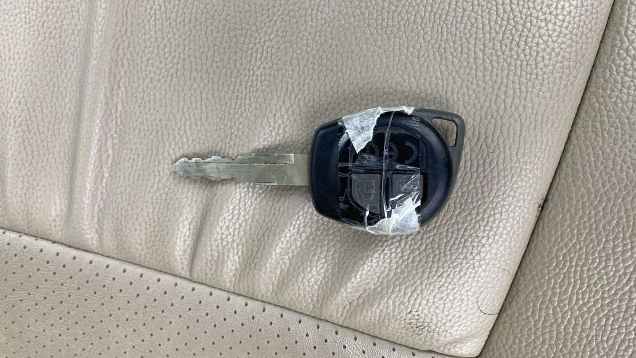 Car key on leather seat of a Maruti Suzuki Dzire 2018-2023