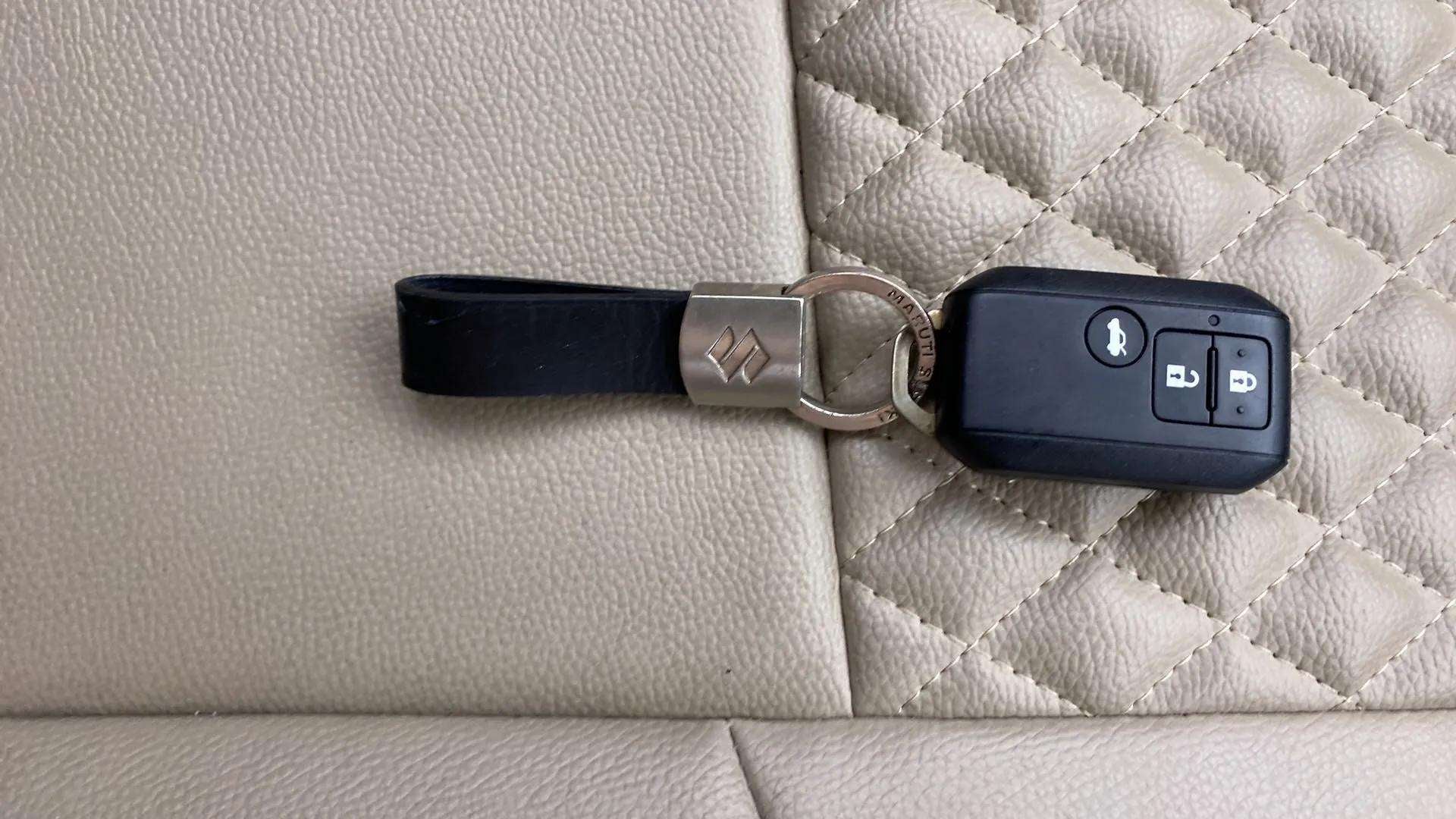 Key fob close-up of a Maruti Suzuki Dzire