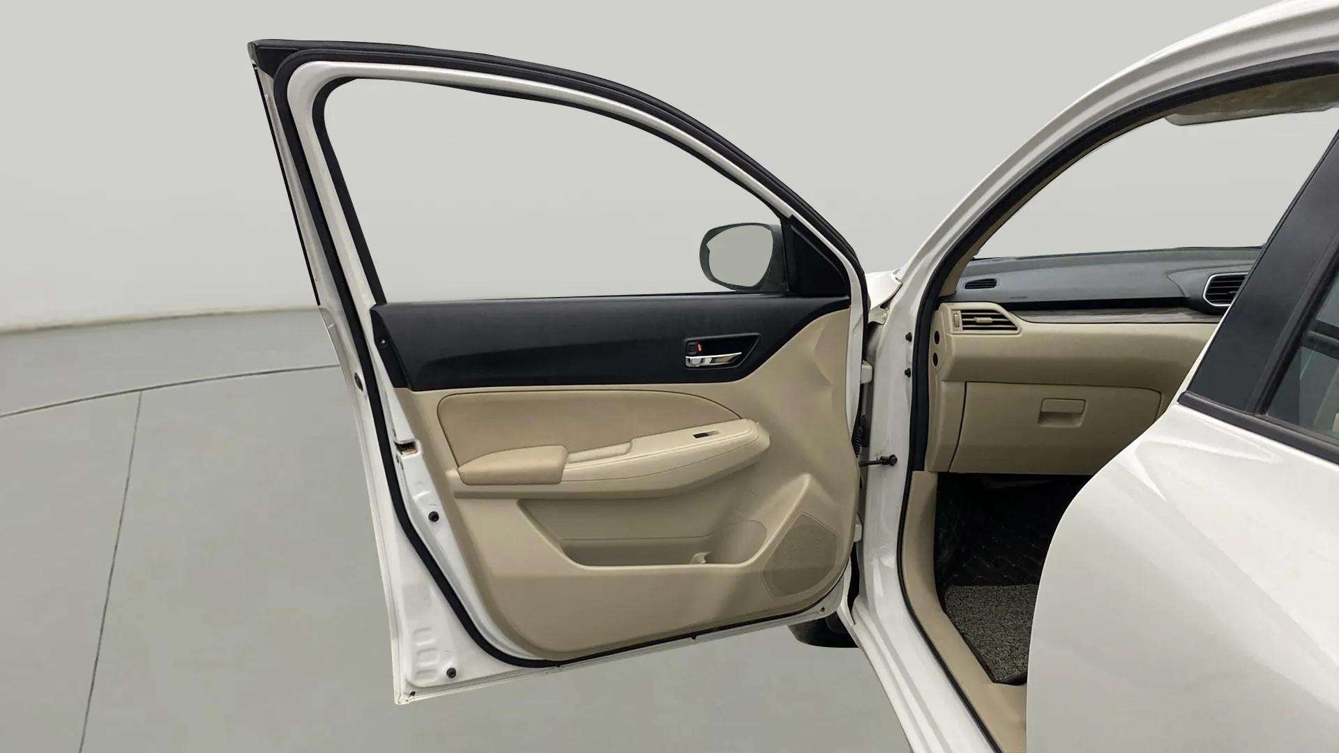 Front passenger door interior of a Maruti Suzuki Dzire