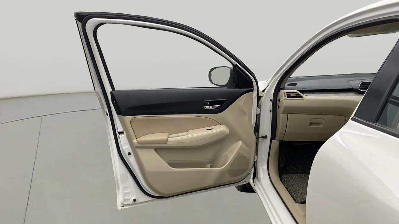 Front passenger door interior of a Maruti Suzuki Dzire