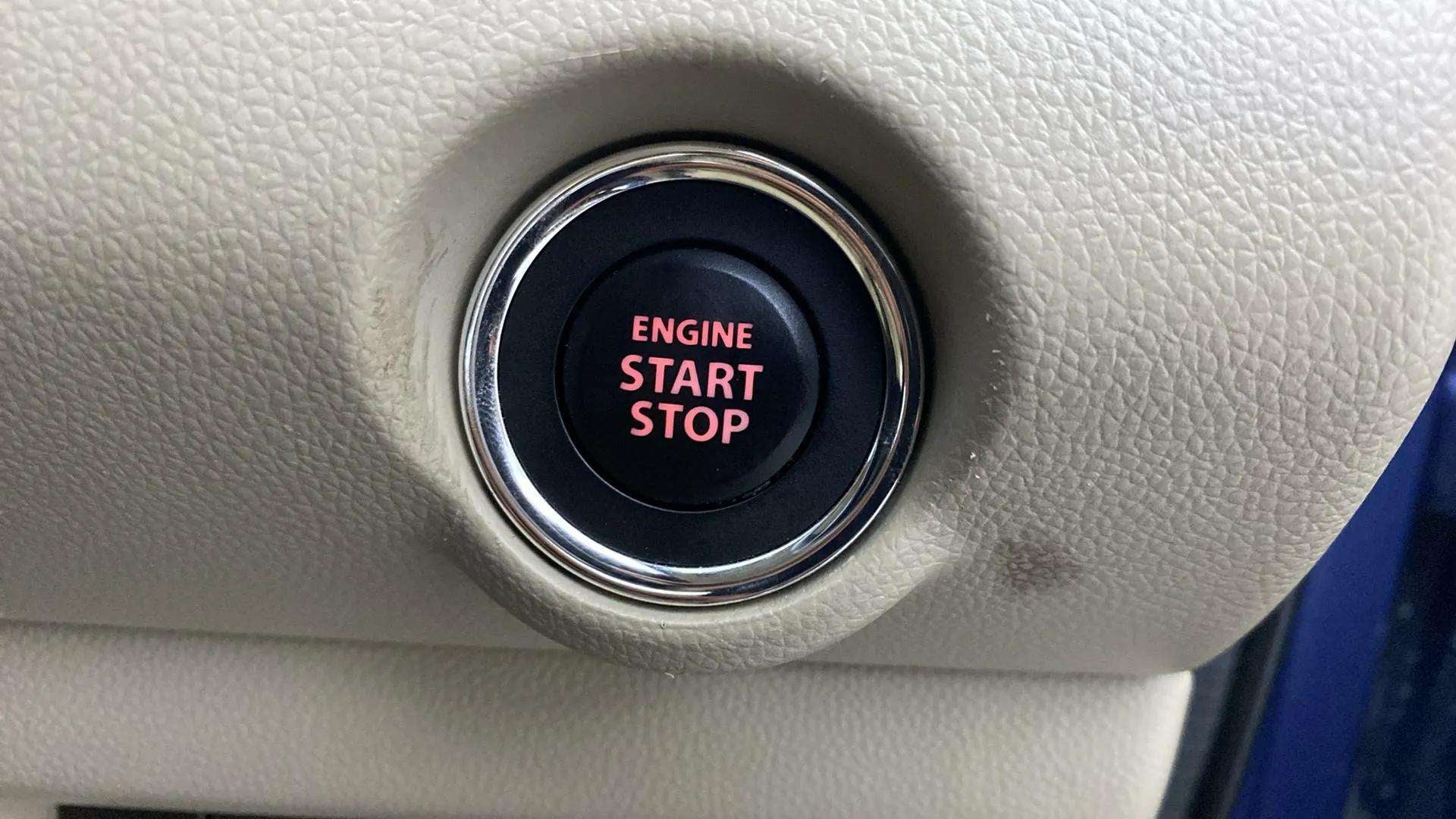 Engine start stop button of a Maruti Suzuki Dzire