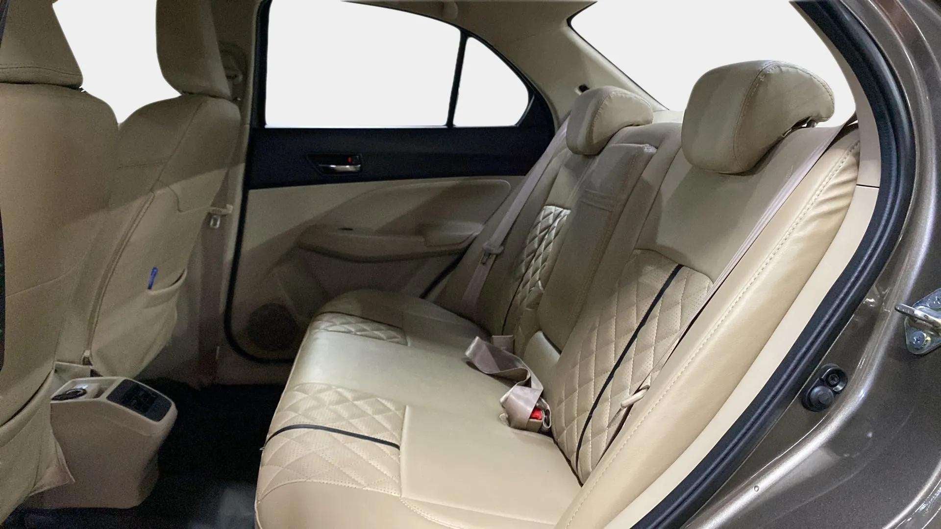 Rear seat and door interior of a Maruti Suzuki Dzire 2018-2023