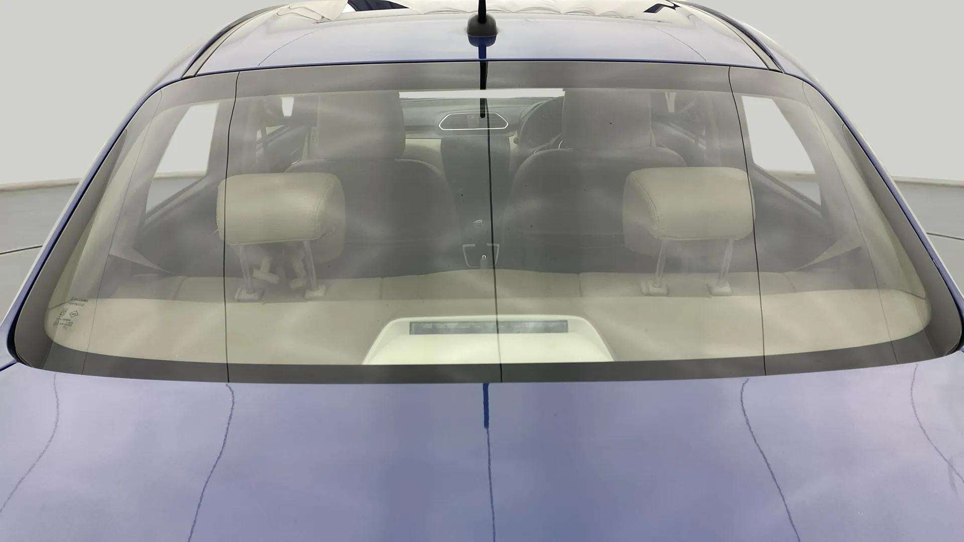 Rear windshield view of a Maruti Suzuki Dzire 2018-2023