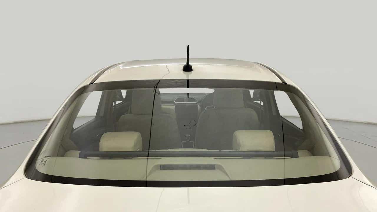 Rear windshield view of a Maruti Suzuki Dzire