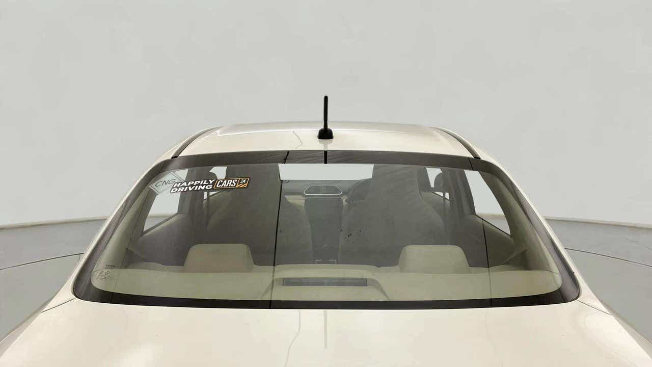 Rear windshield view of a Maruti Suzuki Dzire