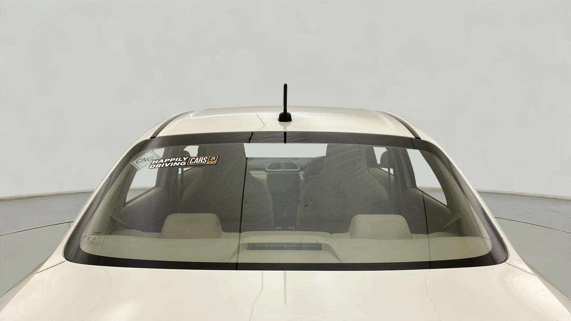 Rear windshield view of a Maruti Suzuki Dzire