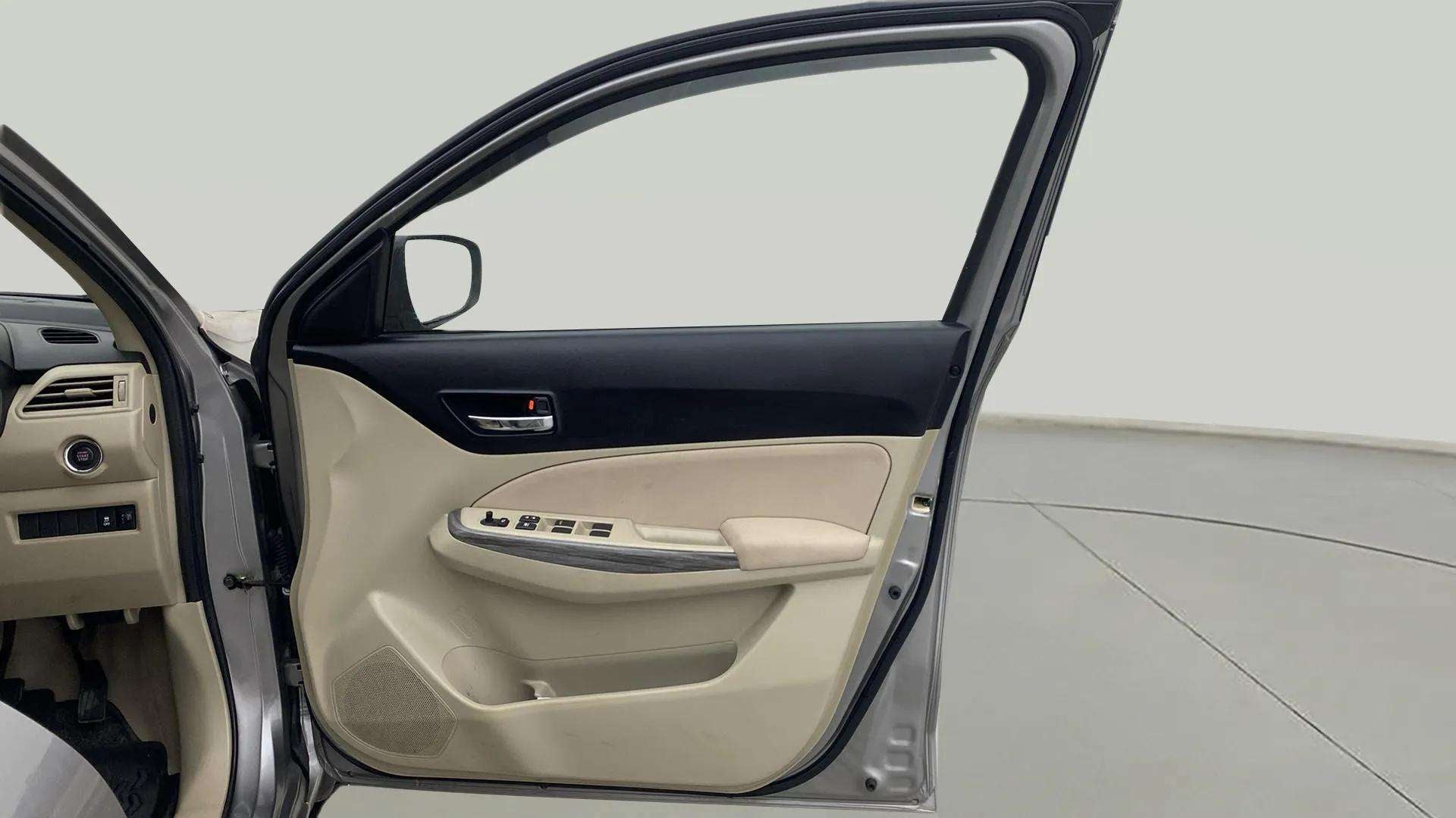 Driver side interior door panel of a Maruti Suzuki Dzire 2018-2023