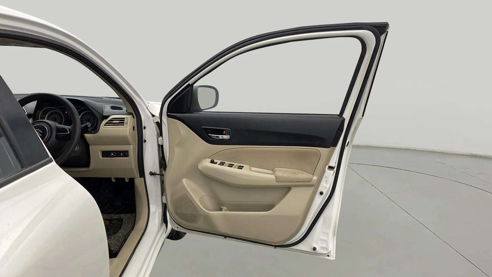 Driver side interior door view of a Maruti Suzuki Dzire