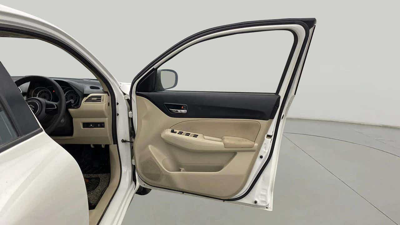Driver side interior door view of a Maruti Suzuki Dzire