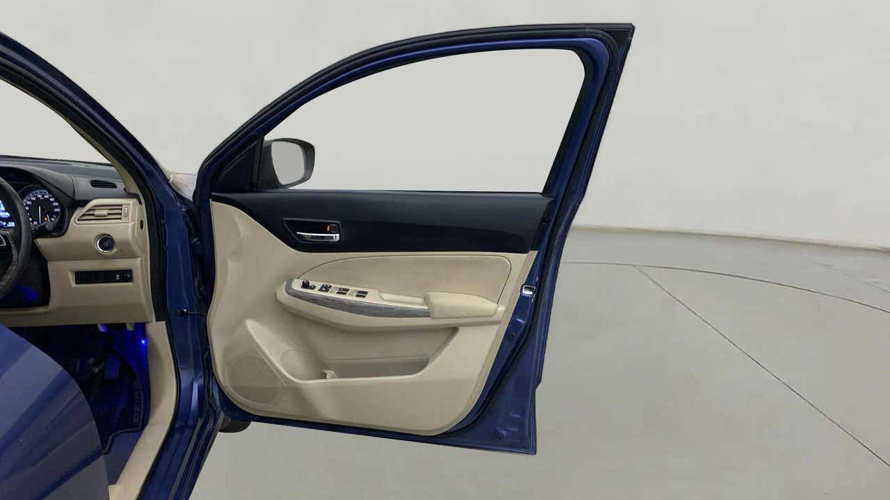 Front driver side door and dashboard of a Maruti Suzuki Dzire