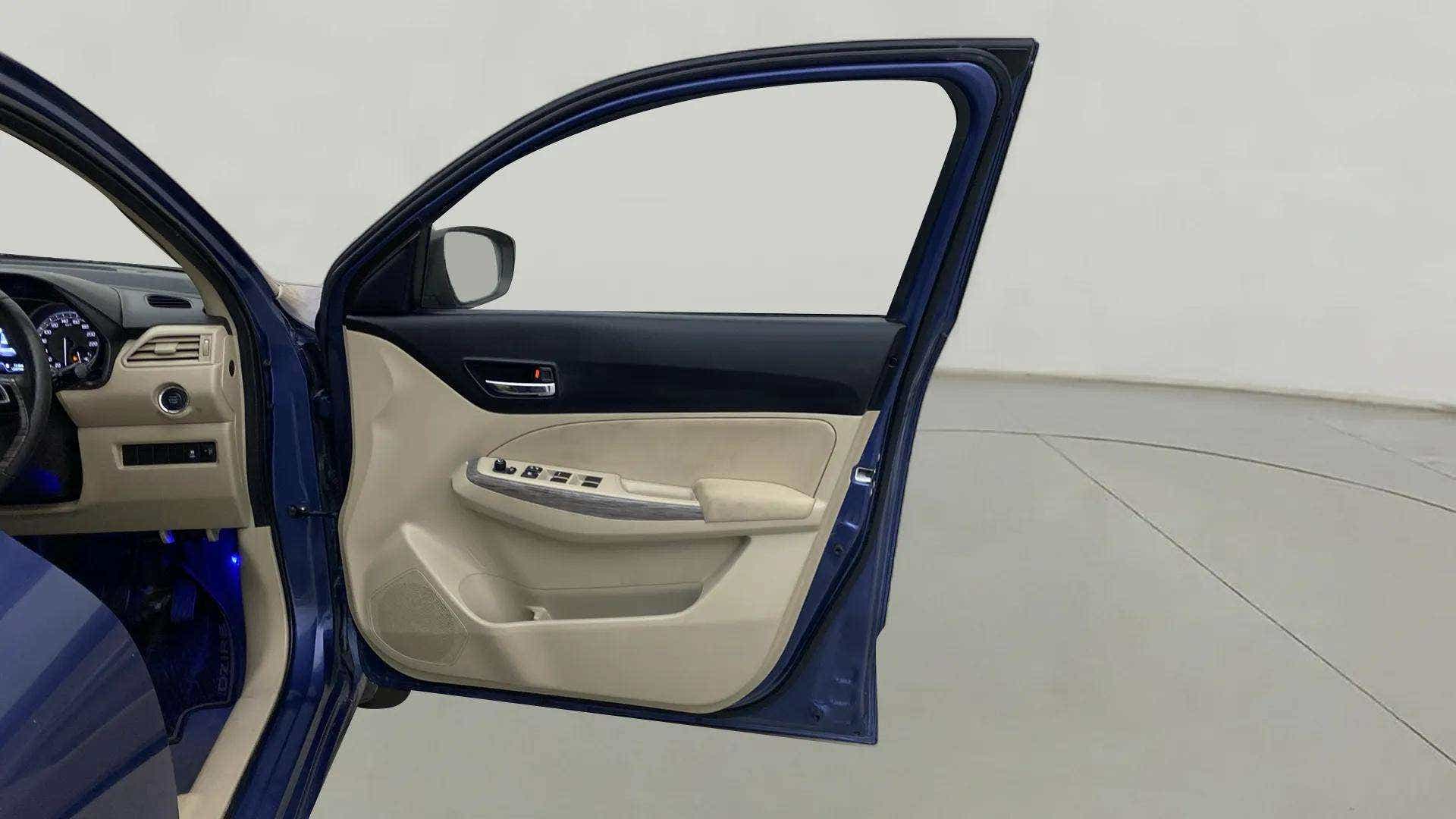 Front driver side door and dashboard of a Maruti Suzuki Dzire