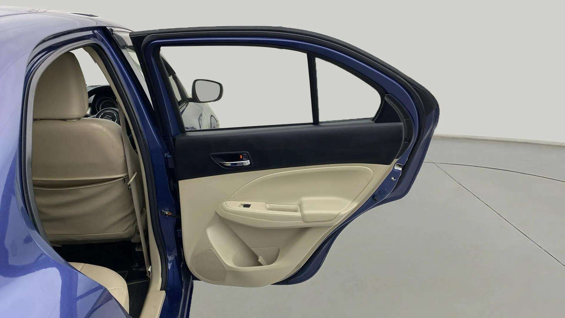 Rear left door open view of a Maruti Suzuki Dzire 2018-2023