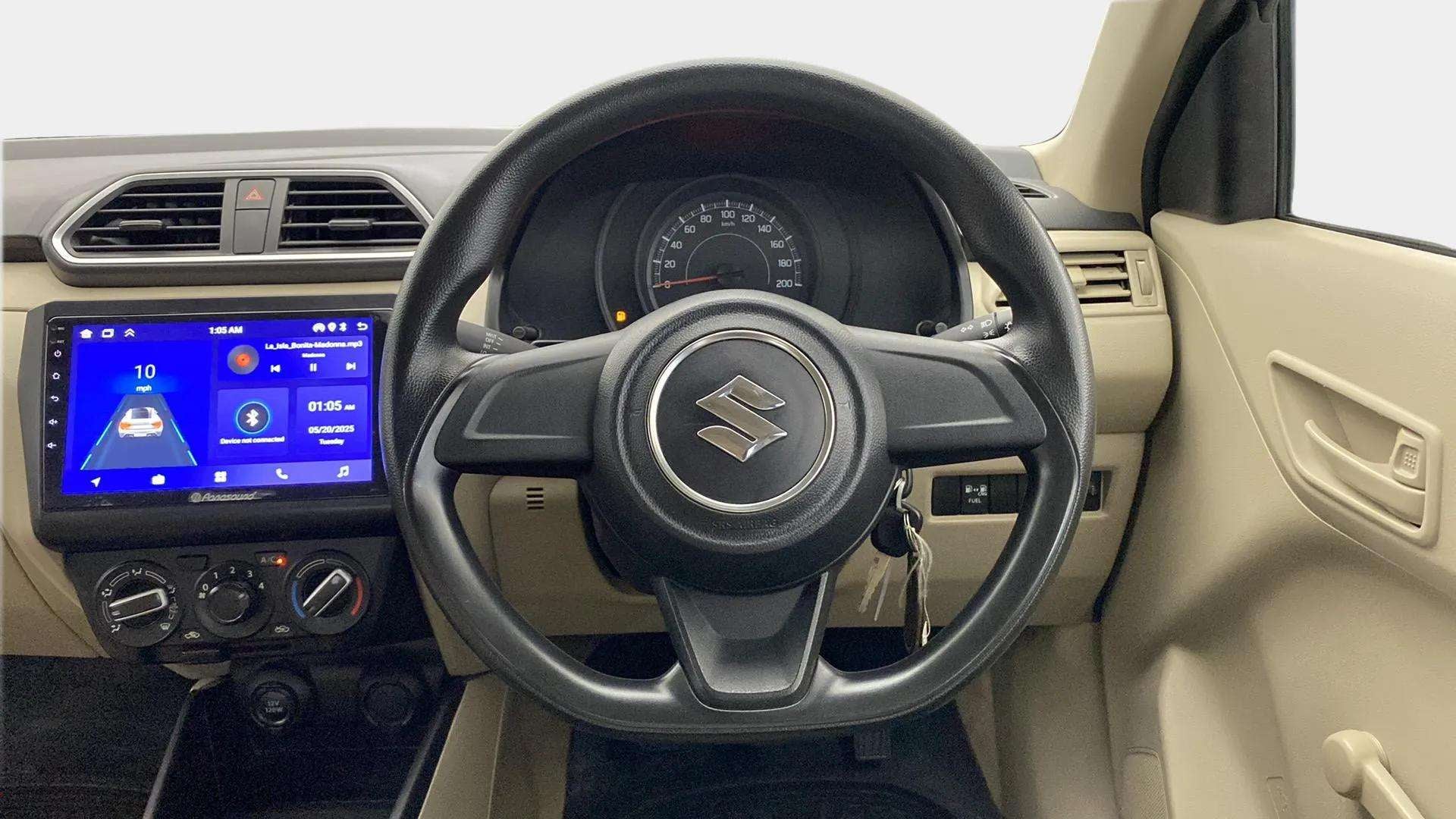 Interior dashboard view of a Maruti Suzuki Dzire