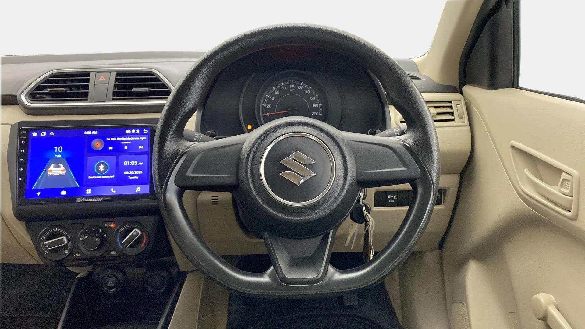 Interior dashboard view of a Maruti Suzuki Dzire
