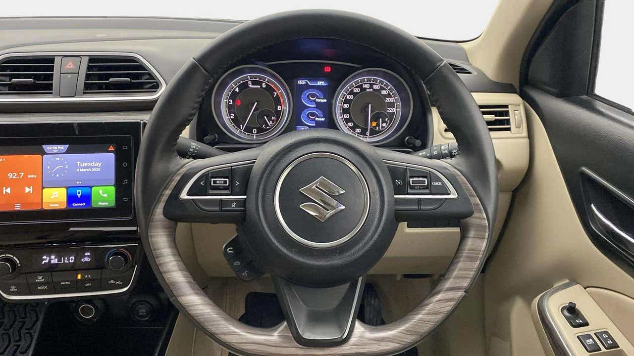 Interior dashboard and steering wheel of a Maruti Suzuki Dzire 2018-2023