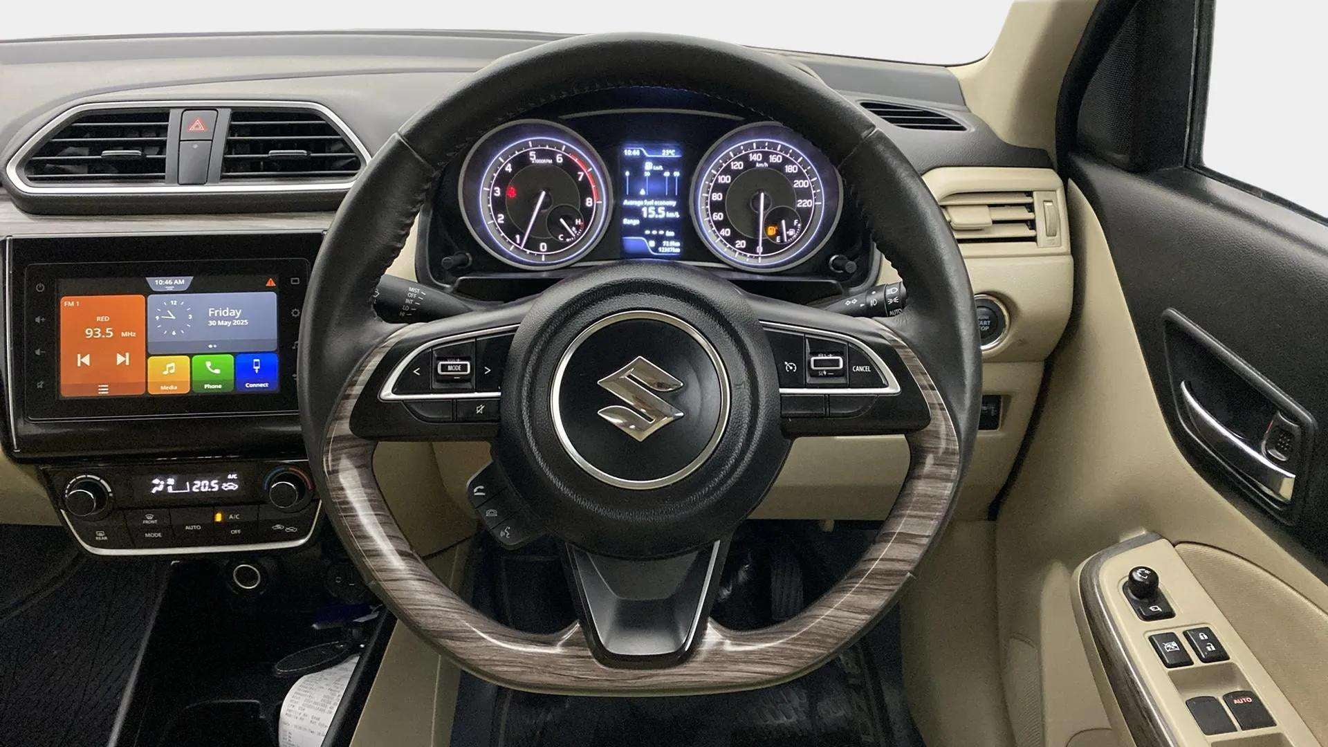 Dashboard and steering wheel of a Maruti Suzuki Dzire