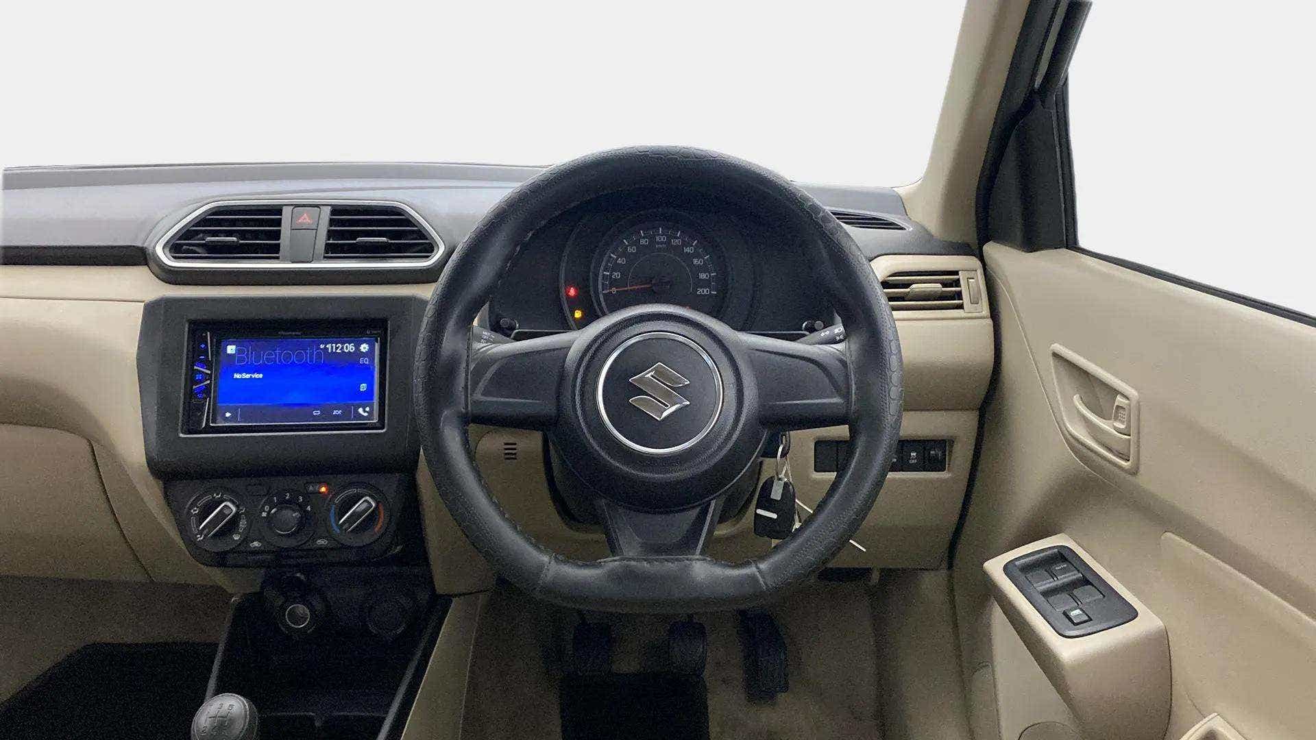 Interior dashboard view of a Maruti Suzuki Dzire 2018-2023