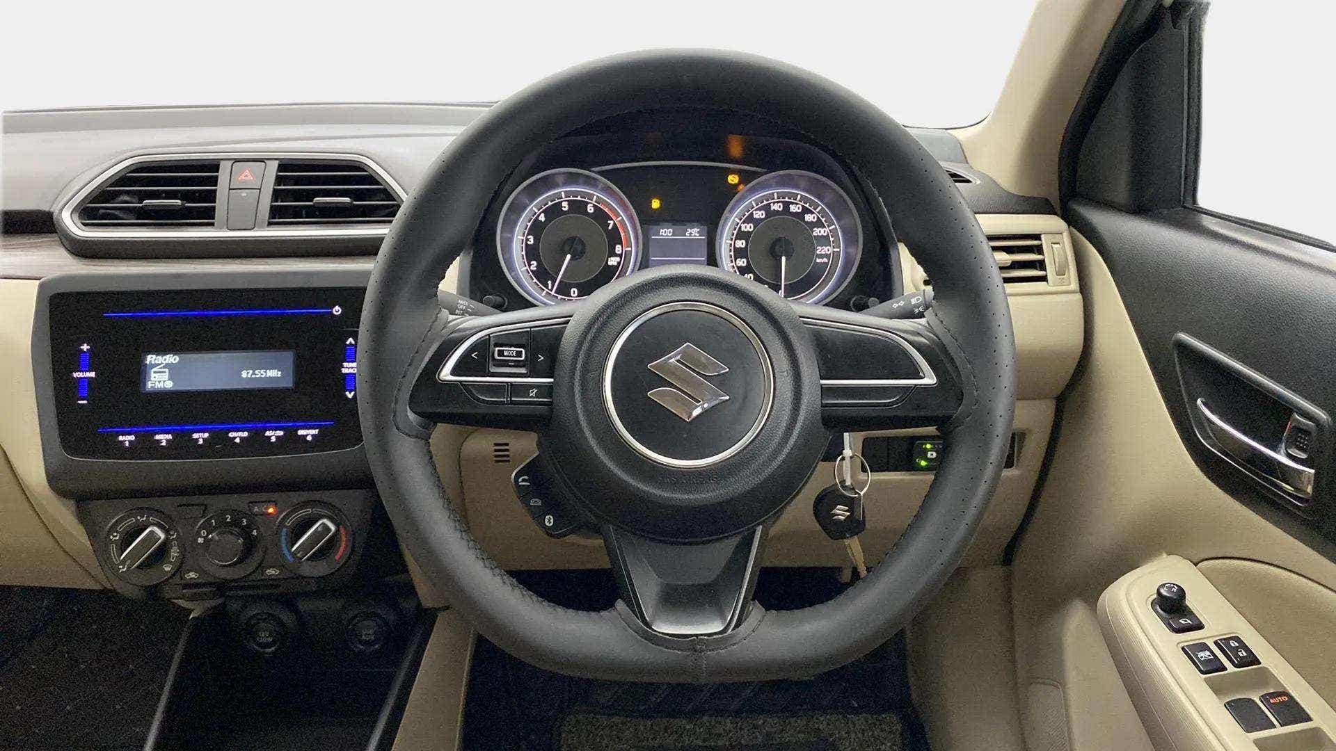 Dashboard and steering wheel view of a Maruti Suzuki Dzire