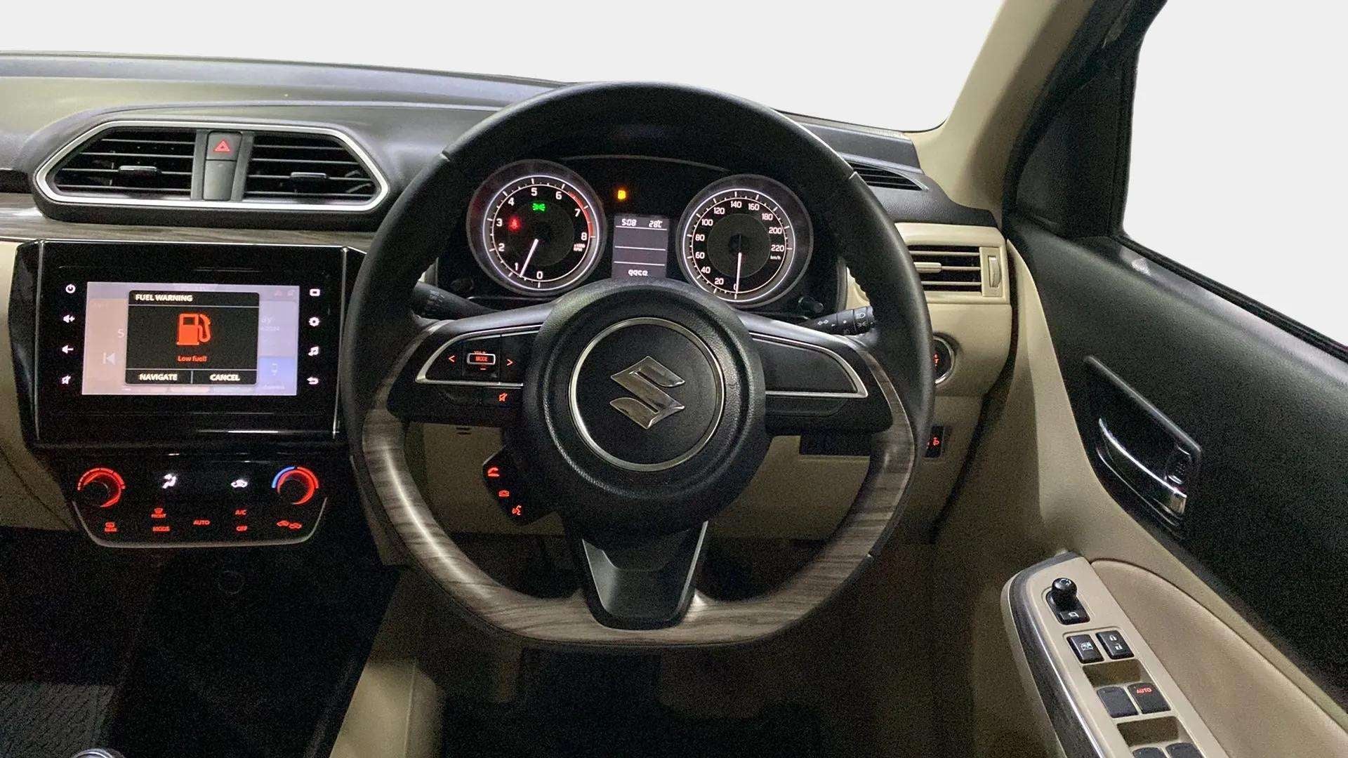 Dashboard and steering wheel view of a Maruti Suzuki Dzire 2018-2023