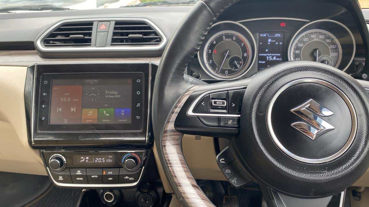 Dashboard and steering wheel of a Maruti Suzuki Dzire