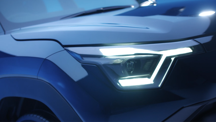 Headlight close-up of a Nexa Blue Maruti Suzuki e Vitara