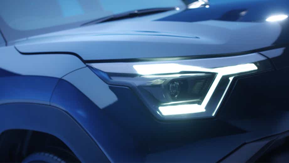 Headlight close-up of a Nexa Blue Maruti Suzuki e Vitara