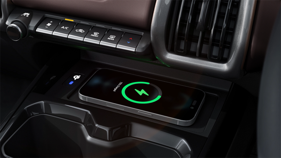 Wireless charging pad and dashboard controls of a Maruti Suzuki e Vitara