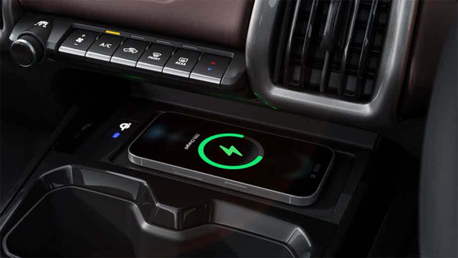 Wireless charging pad and dashboard controls of a Maruti Suzuki e Vitara