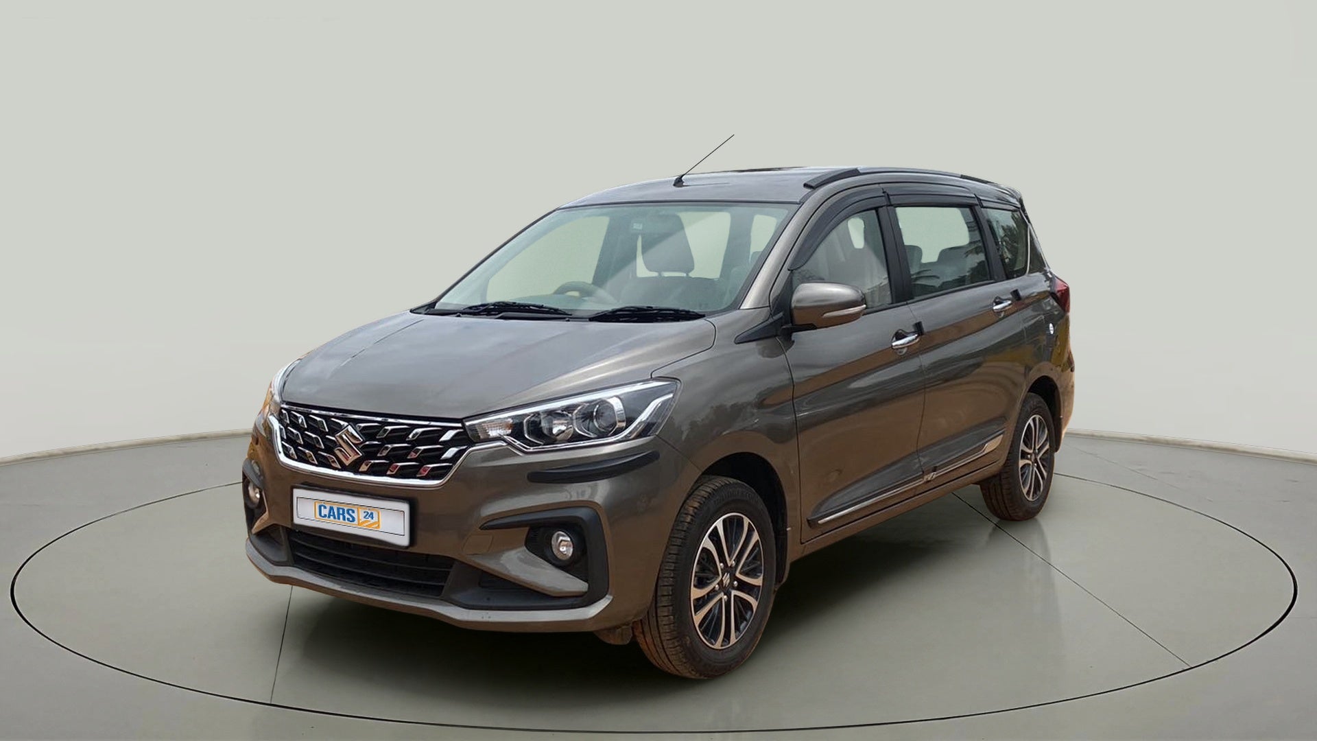 Front three-quarter view of a Magma Grey Maruti Suzuki Ertiga