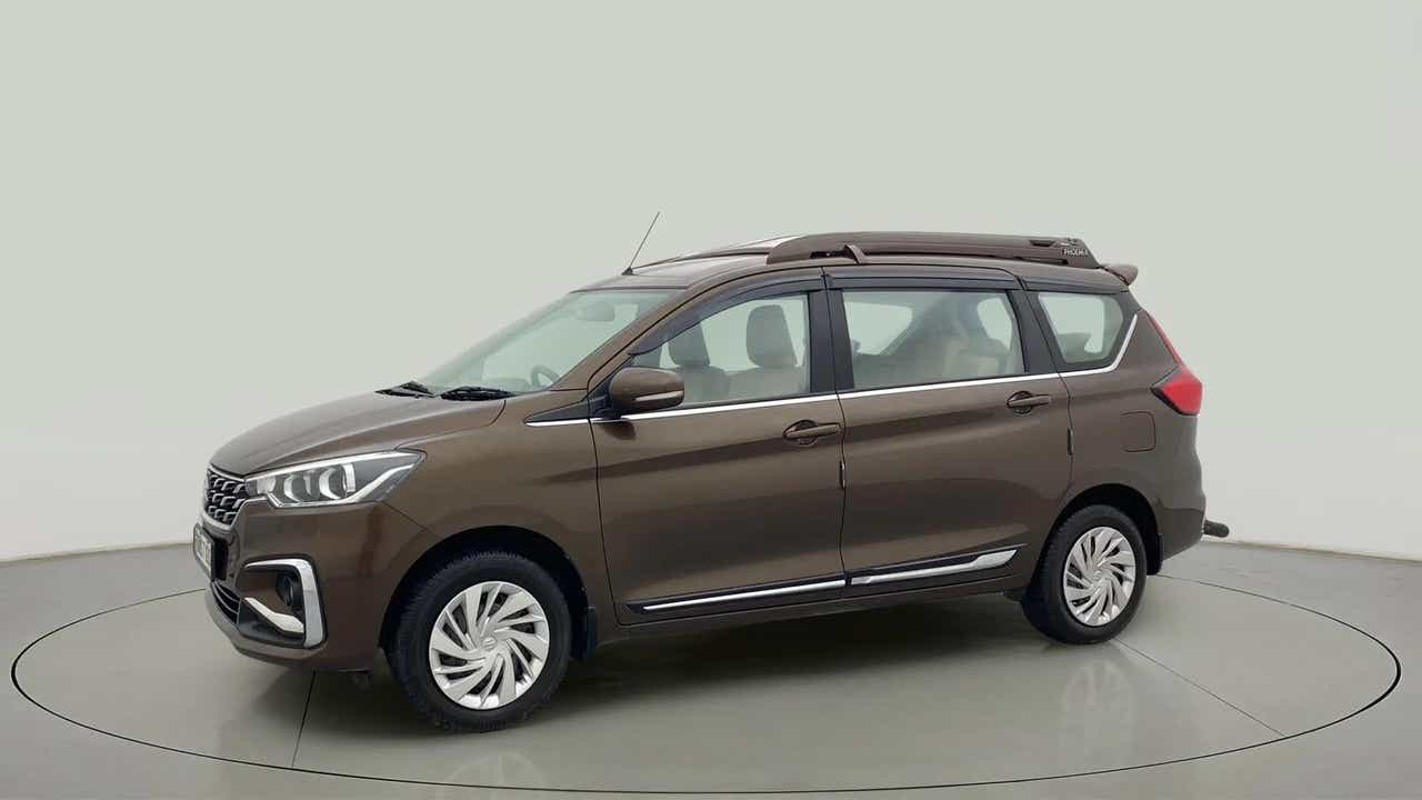 Side view of a Pearl Metallic Dignity Brown Maruti Suzuki Ertiga