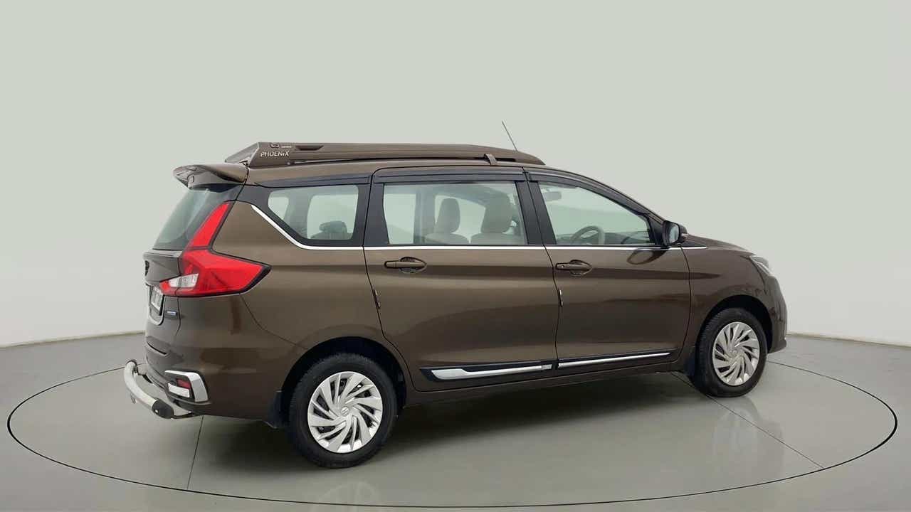 Rear three-quarter of a Pearl Metallic Dignity Brown Maruti Suzuki Ertiga