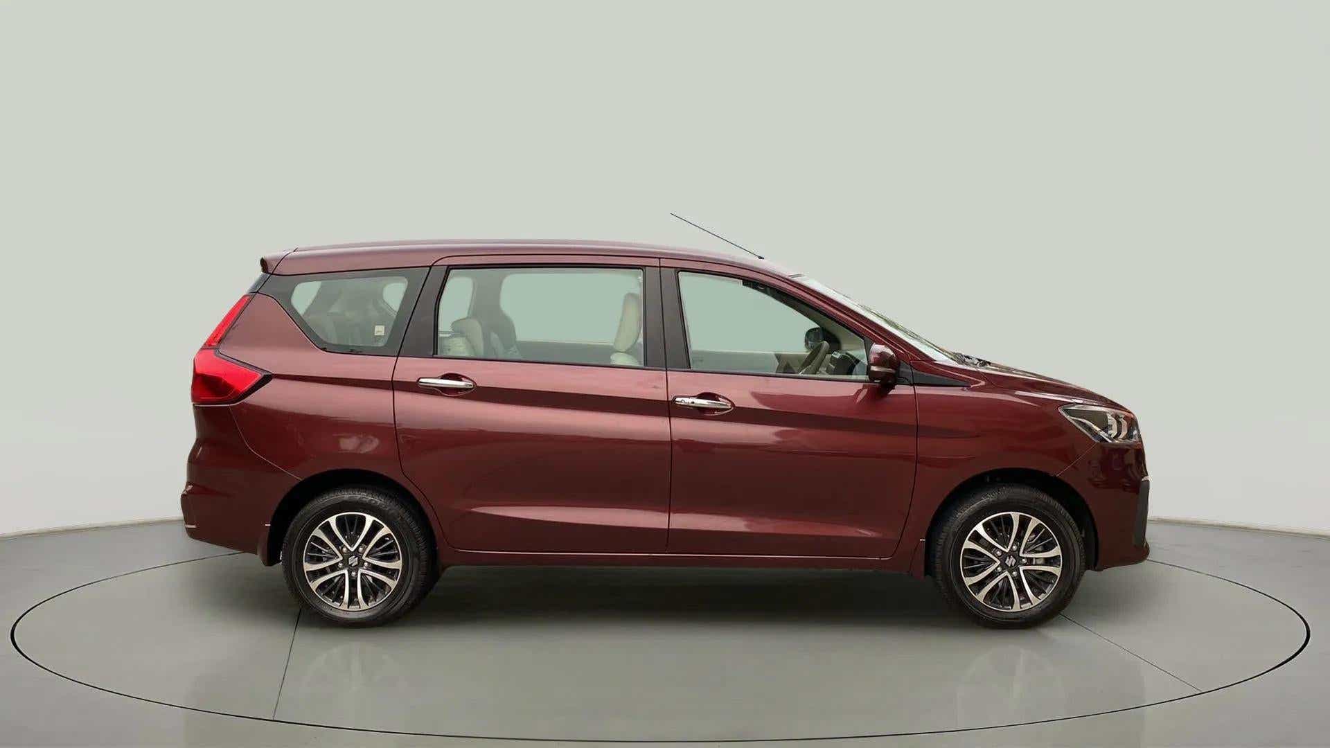 Side view of a Pearl Metallic Dignity Brown Maruti Suzuki Ertiga