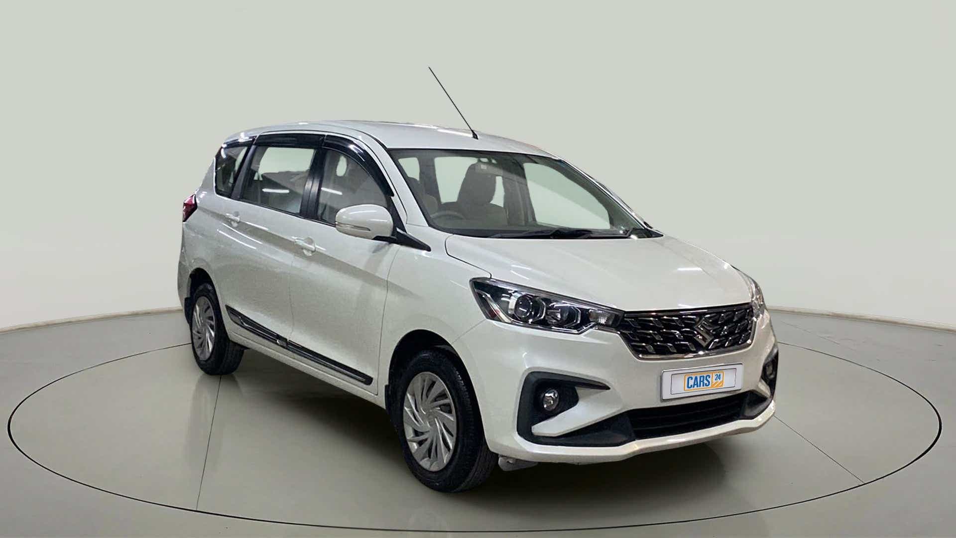 Front three-quarter view of a Pearl Metallic Arctic White Maruti Suzuki Ertiga