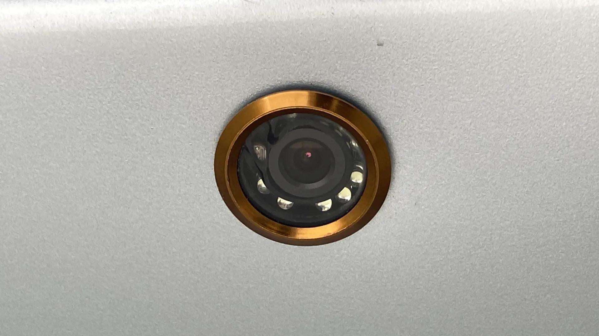 Close-up of a camera lens on a Maruti Suzuki Ertiga