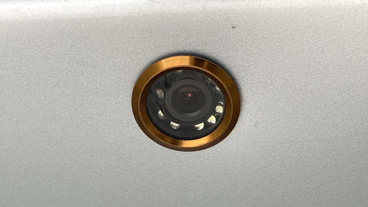Close-up of a camera lens on a Maruti Suzuki Ertiga