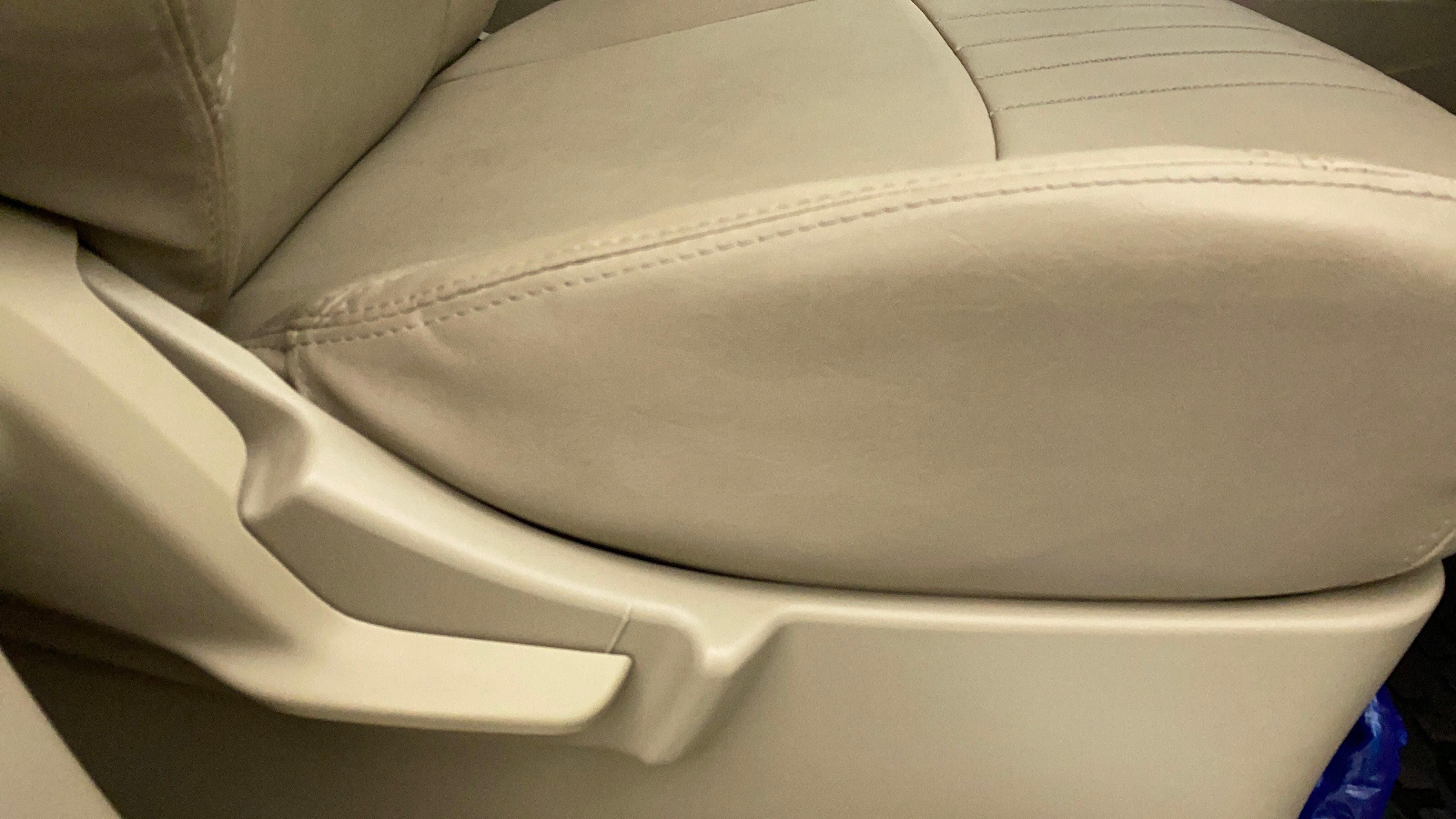 Close-up of a seat adjustment lever on a Maruti Suzuki Ertiga