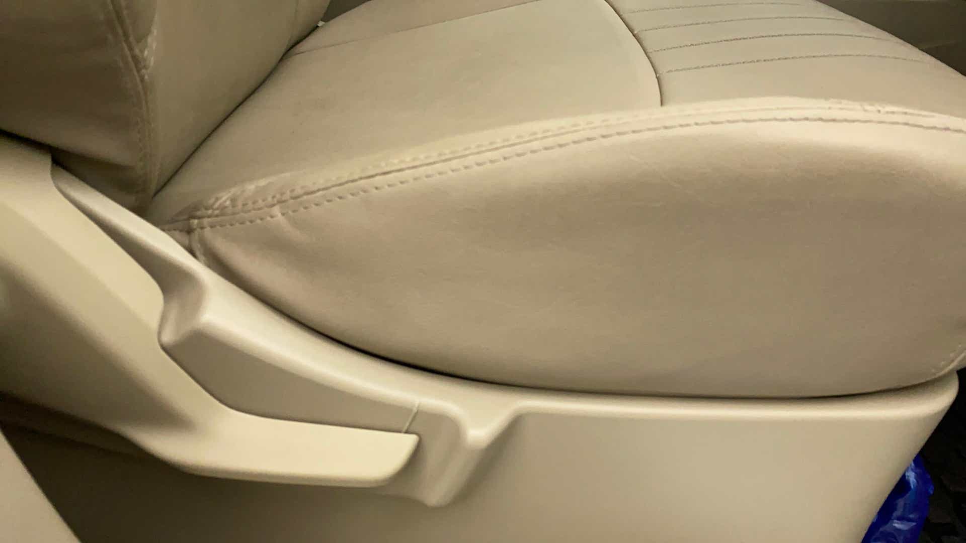 Close-up of a seat adjustment lever on a Maruti Suzuki Ertiga