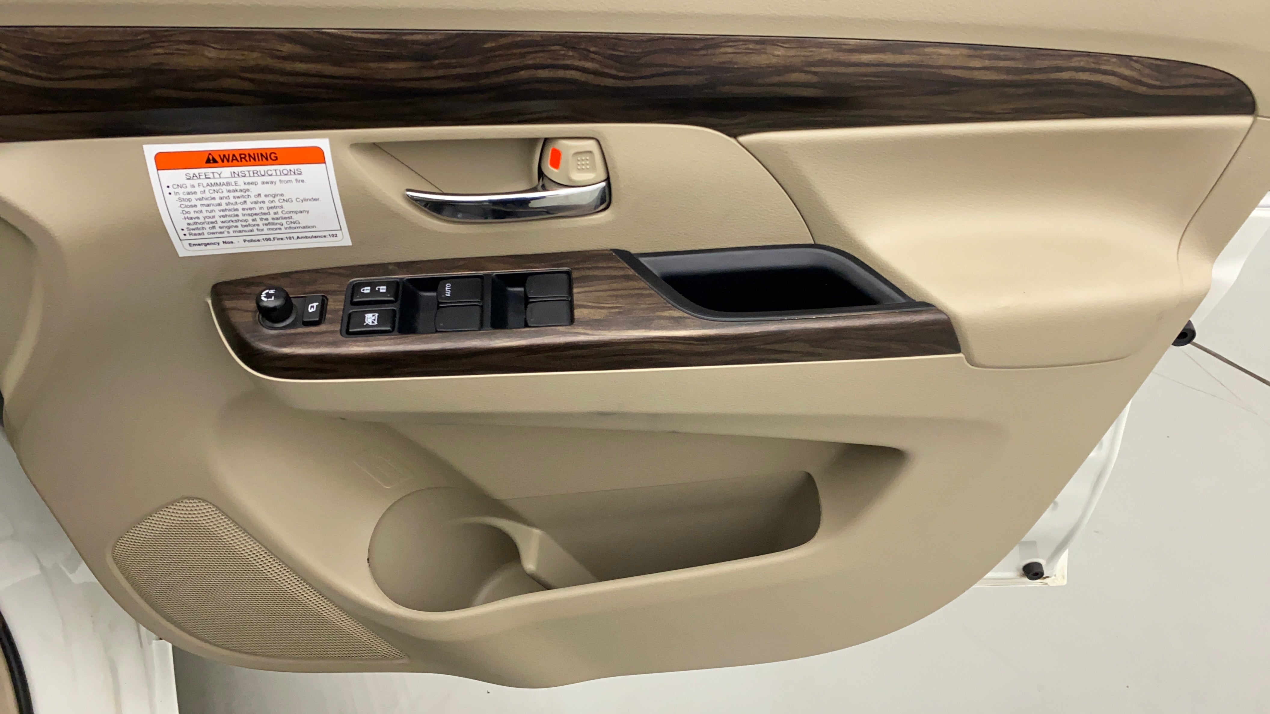 Interior driver side door panel of a Maruti Suzuki Ertiga